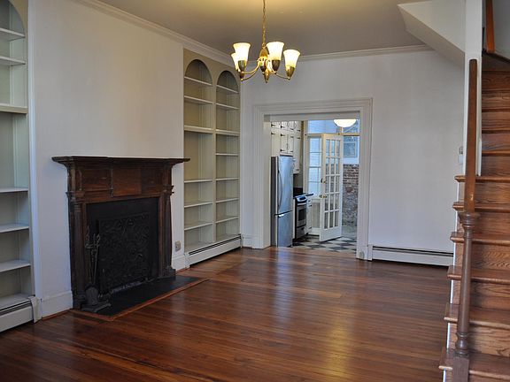 High ceilings, built-in shelving, fireplace and beautiful, historic hard wood floors.