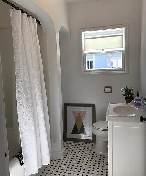 Full bathroom with tub and shower.