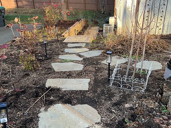 Stepping stones to the stairs that lead to the apartment.