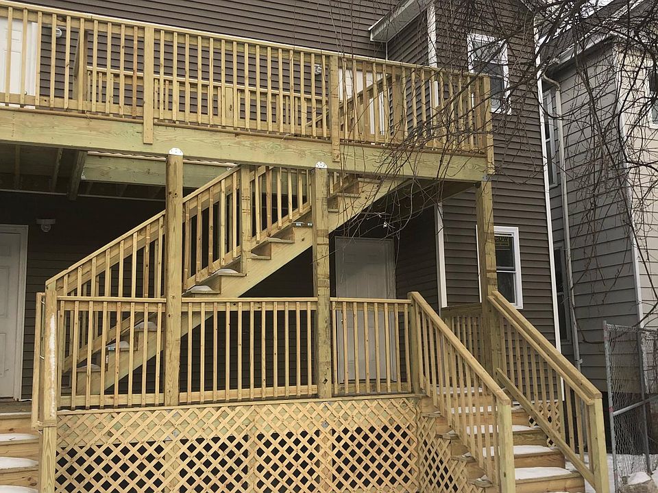 Rear of the building standing in the backyard.