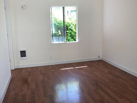 Living space has wall heater and ceiling fan