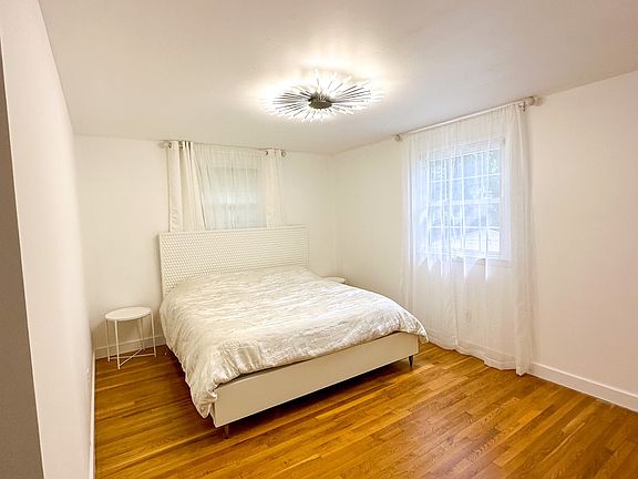 Primary bedroom can hold a king bed, has beautiful hardwood flooring, ensuite full bath and walk-in closet.