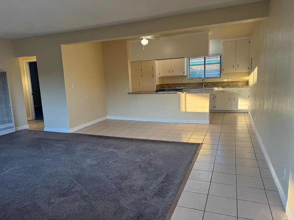 Looking from front door towards kitchen and dining area.
