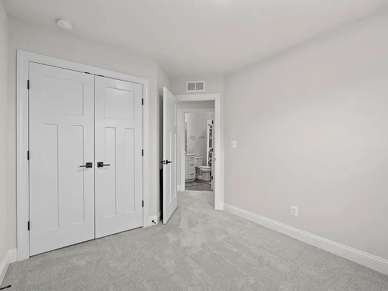 Bedrooms have grey carpet. Quality doors have shaker-style