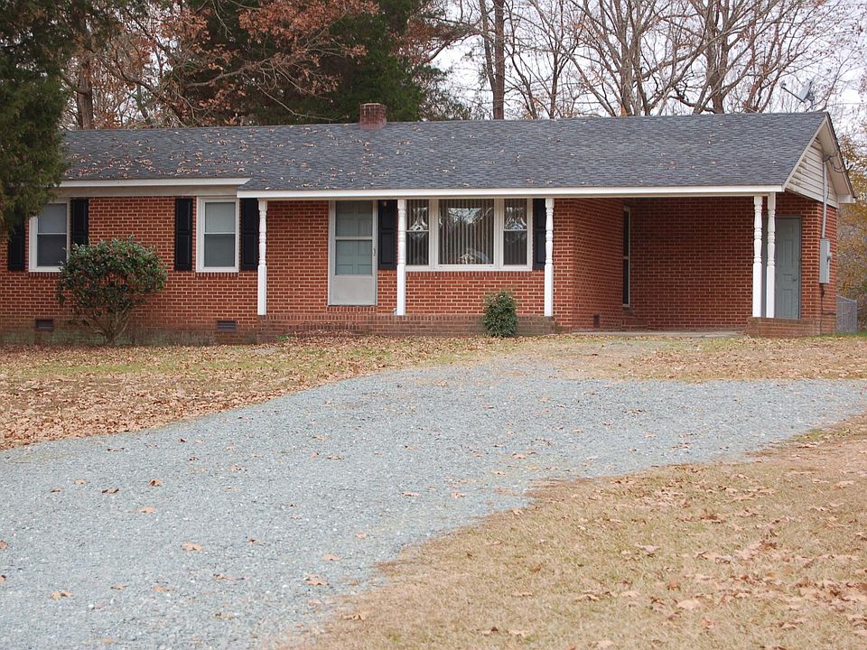 Front of Home showing Carport and Storage