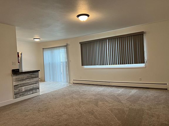 Open living room with NEW carpet!