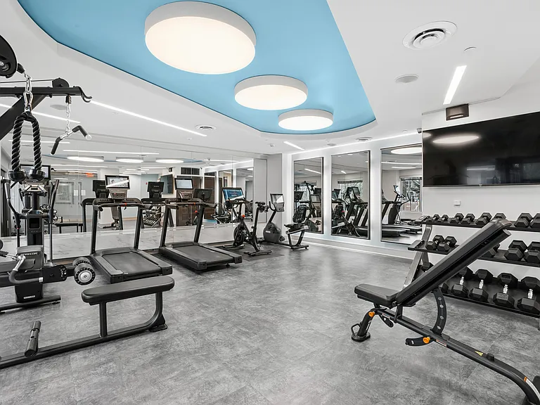 24 Hour fitness center with cardio and strength training equipment