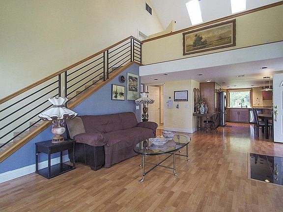 Open floor plan living room with wood burning stove