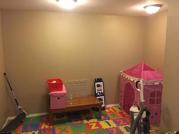 Lower level family room, office space, or kids area.