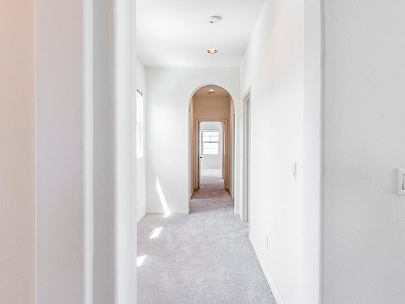 Beautiful arched architecture throughout the hallways of the home