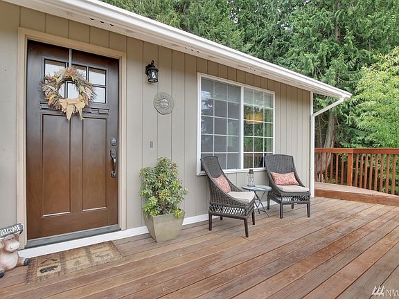 Inviting entry features new front door with keyless entry.