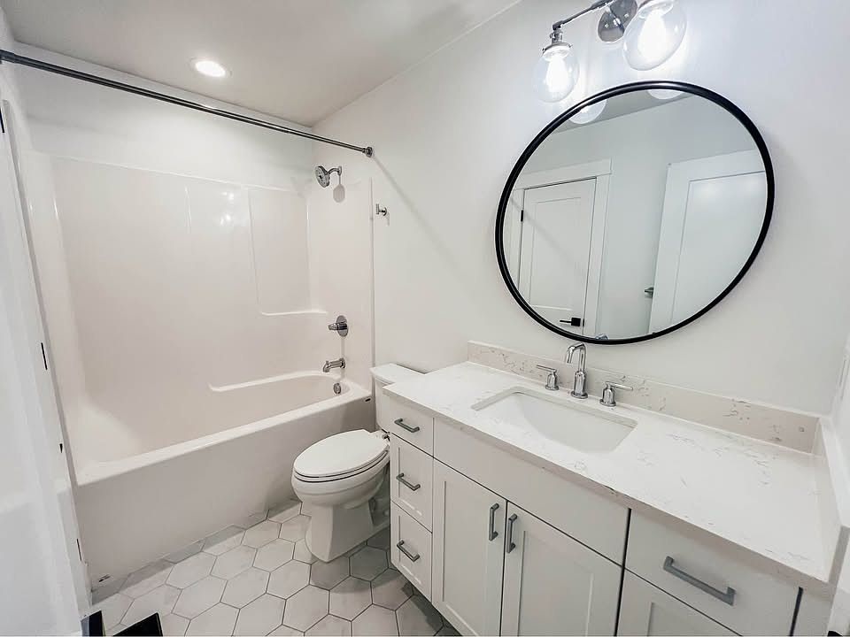 Modern full bathroom with updated fixtures and clean, contemporary design.