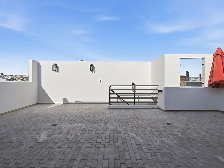 In the top of the third floor you will find a chef's kitchen with walk-in pantry, breakfast nook, 8-sit dining table, and rooftop patio with direct stair access to the street