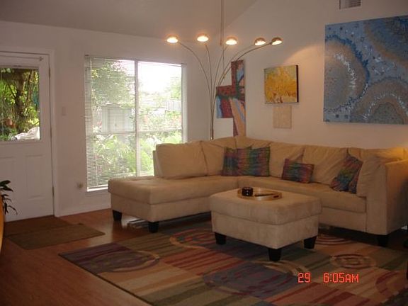 View of living room with laminated flooring