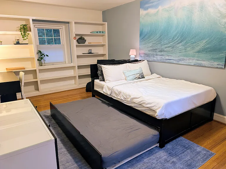 3rd spacious upstairs bedroom with a full-size bed and twin trundle