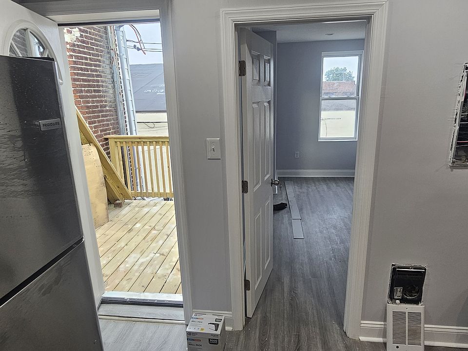 Door to the balcony on the left, door to the back bedroom on the right. Electric panel box cover will be going on asap, heater cover will go on also.