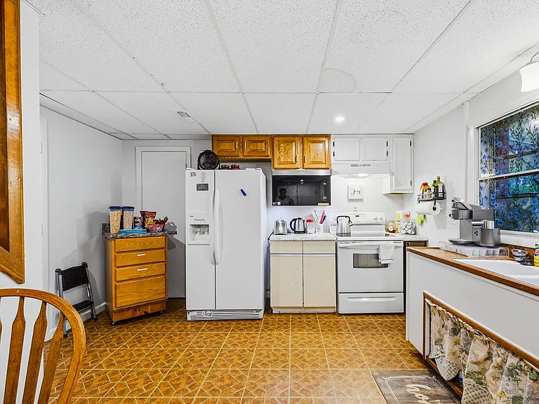 TERRACE LEVEL: Kitchen, Dining and Laundry (behind camera)