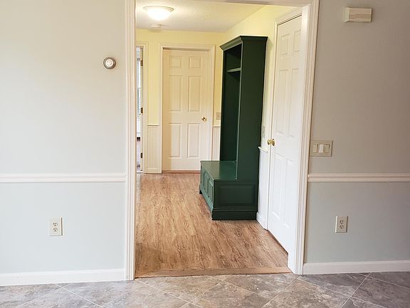 Looking into foyer with built in.