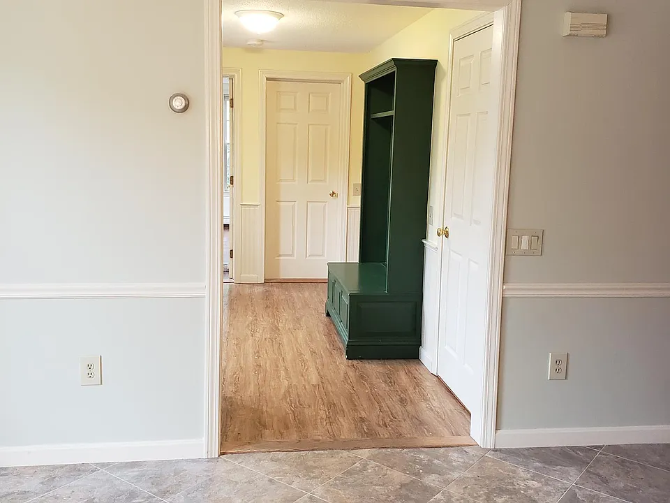 Looking into foyer with built in.