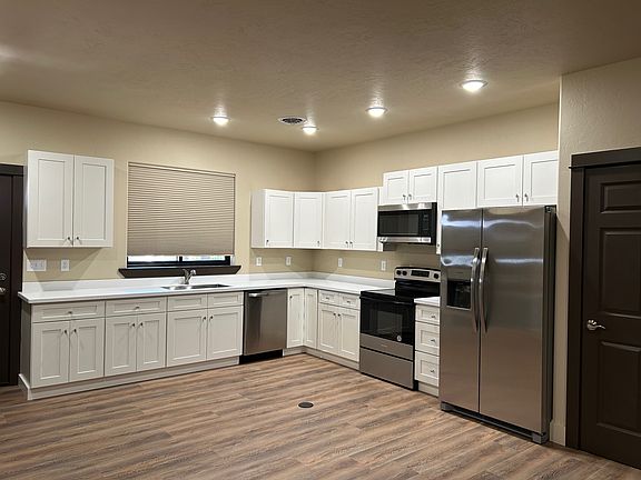 Large kitchen with stainless steel appliances