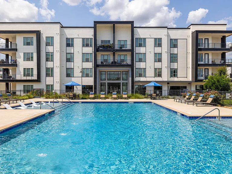 Rhythm Resort-Style Pool with Chaise Lounge Seating and Sundeck