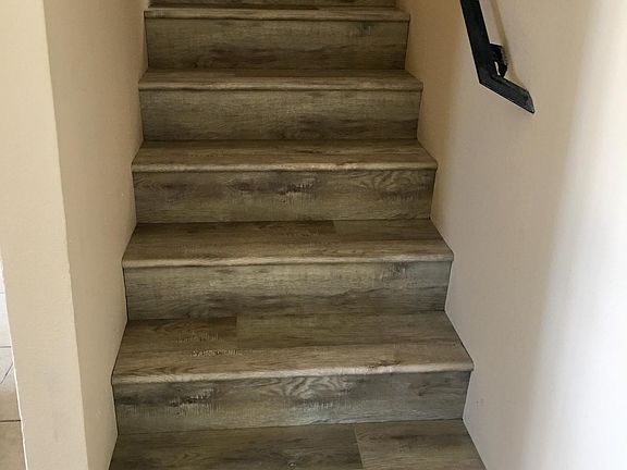 Tile and vinyl flooring throughout