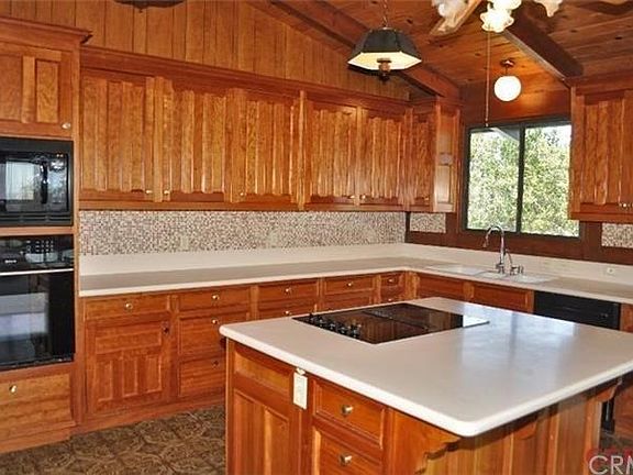 Rich Cherrywood cabinets in the upper house kitchen