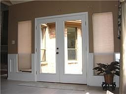 Den with recent French door leaded to outdoor