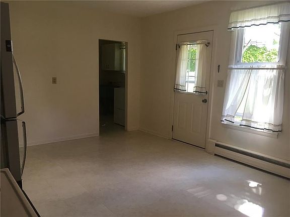 KITCHEN different viewpoint from the refrigerator.  Facing the rear door with small porch and awning.  Open door leads to the ma