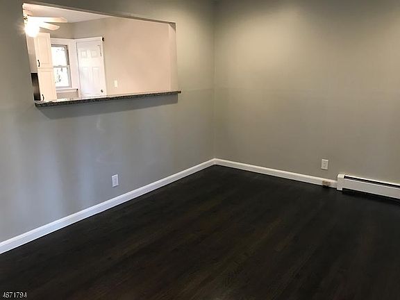 living room,hardwood floors,wall unit ac