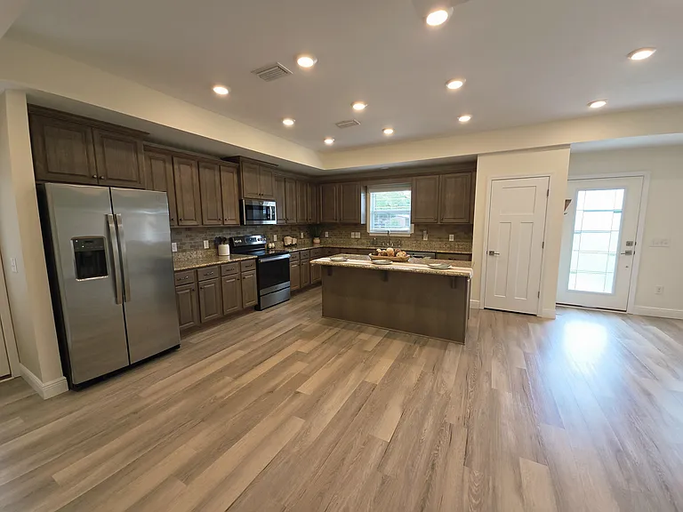 Large kitchen open to living room.