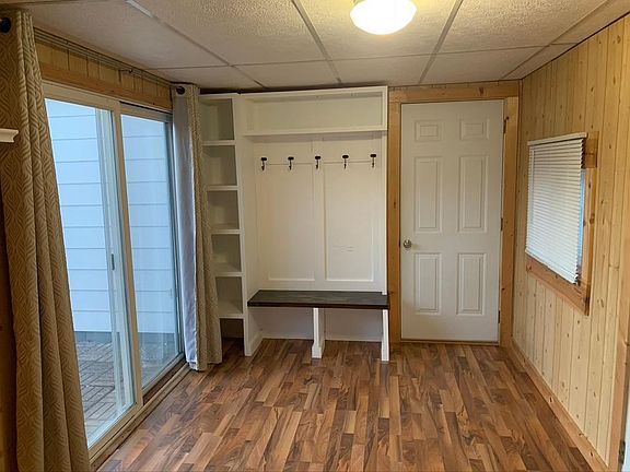 Mudroom/drop area with door leading to attached garage