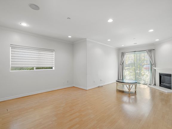 Living and dining room, with private patio and fireplace