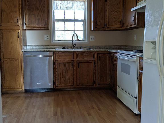 Kitchen; 10 x 11; wood floor; small eat-in area; refrigerator; electric stove, dishwasher; disposal; ceiling fan