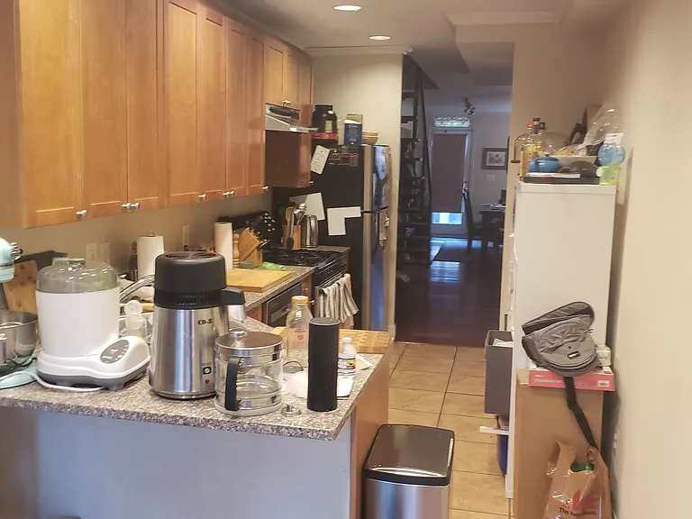 First level galley kitchen looking towards the front of the home.