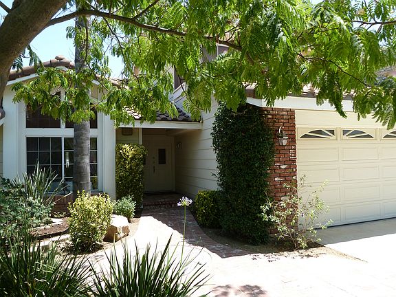 Shaded brick walkway and entrance