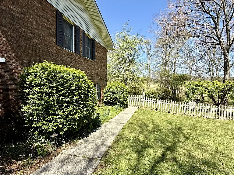 Side of house and pathway to lower level apartment