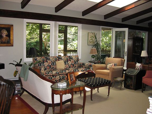 Living room looking to screen porch