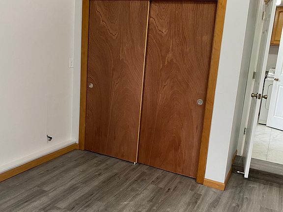 Large bedroom : New sliding closet door with shelves.