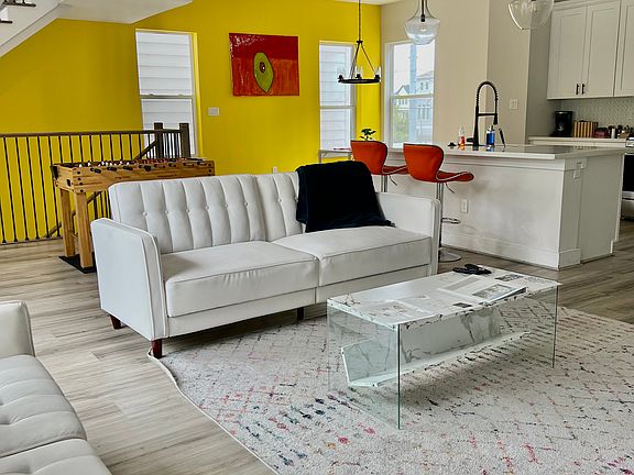 Living room with yellow accent wall view