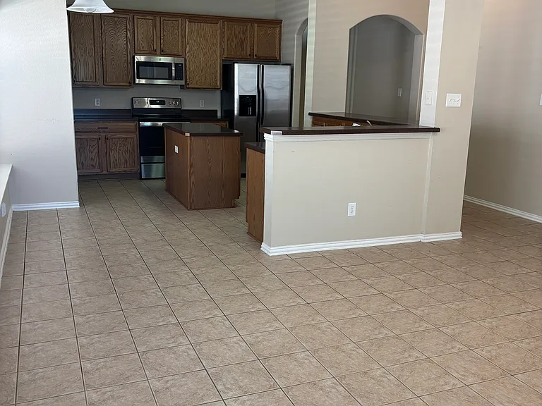 Standing at back of house looking into kitchen