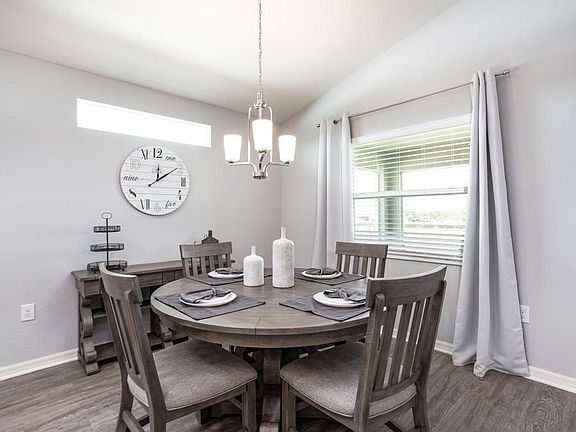 Sunny cafe space - New home for sale in Lake Alfred, FL. Photo showcases the home layout - colo