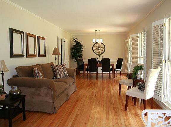 Beautiful Living/Dining Room. Home has refinished hardwood floors throughout.