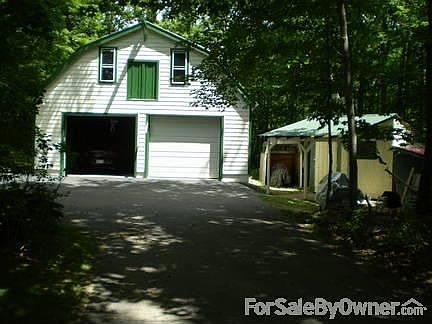 gambrel garage and tool shed : this view is looking in the driveway. note large storage room above g
