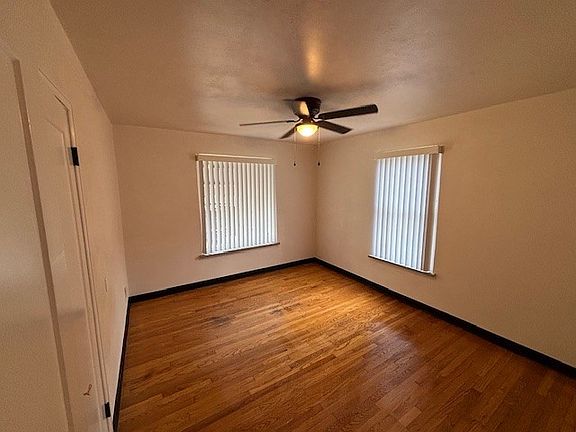 Master Bedroom (featuring new window treatments as well as new ceiling fan)