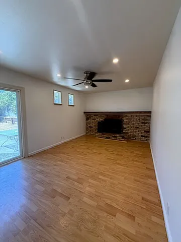 Living room 2 with access to backyard and 2 car garage. Fireplace NOT for use.