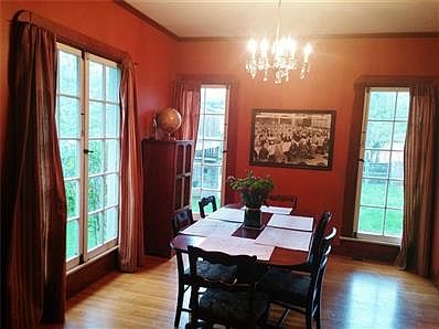Living room and dining room have beautiful oak floors and lots of natural light.