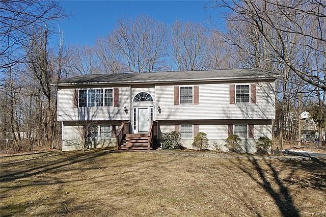 Lovingly maintained ranch style home set on a level, private acre.