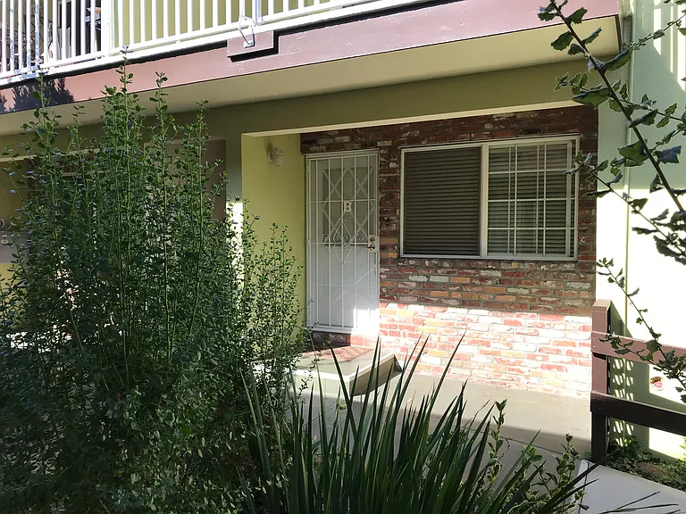 Additional outer steel security gates are installed for both front and rear entry doors.