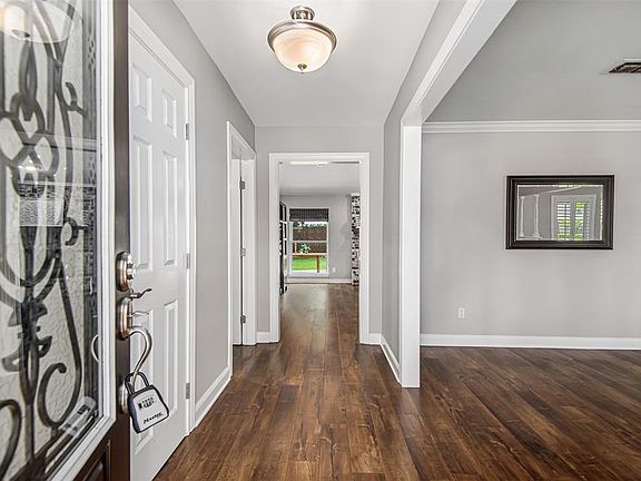As you walk through the front door, the formal living and dining are to the right. The main living area is straight ahead.